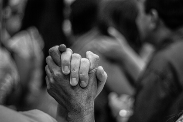 two people's hands together 