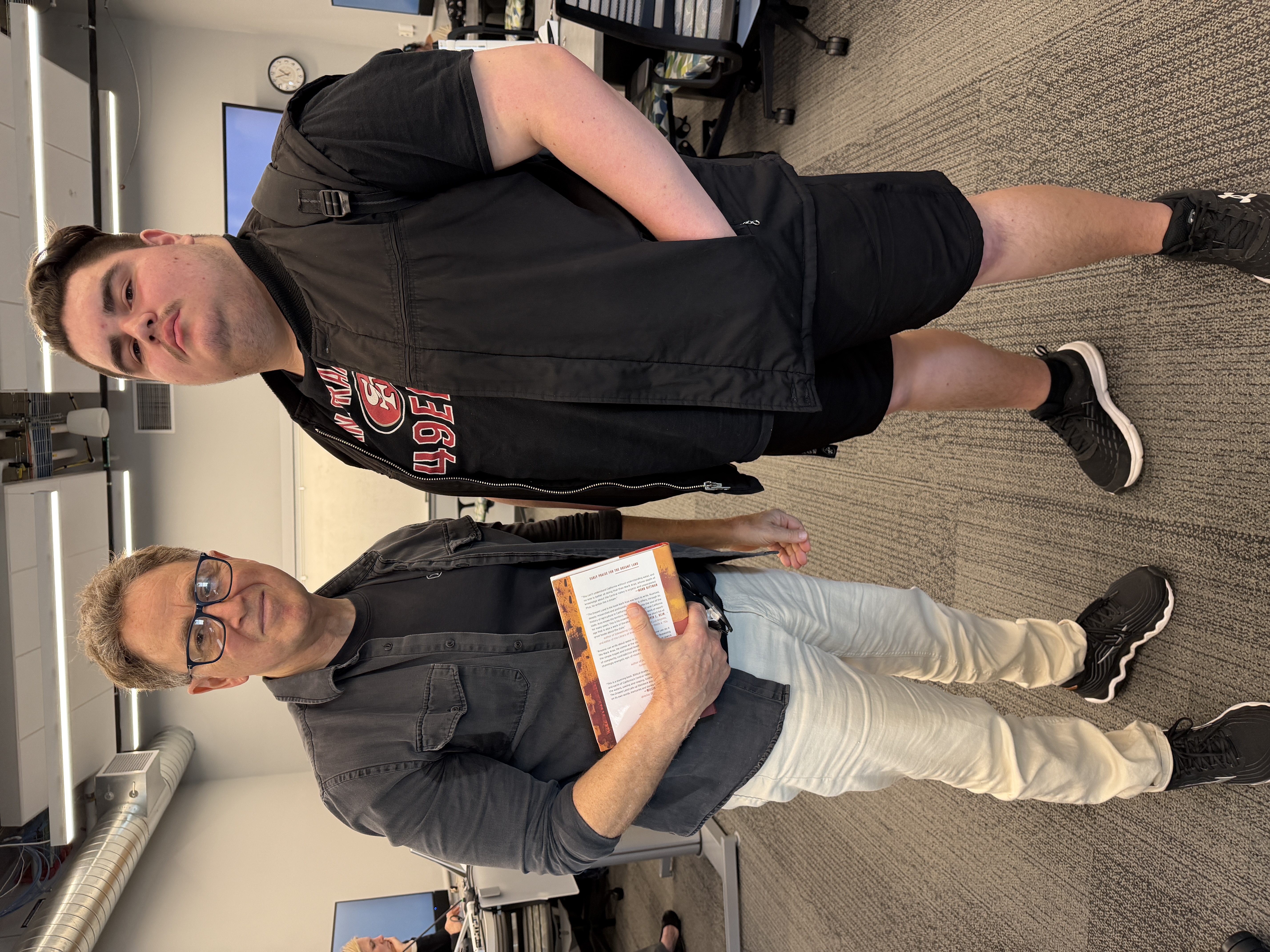 Mark Arax at left and student at right, stand in classroom